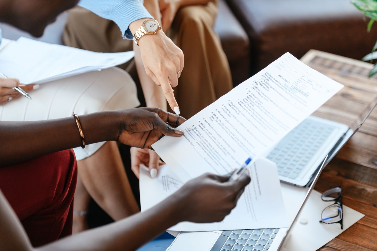 Financial advisor explaining debt counselling and debt review options to a South African consumer